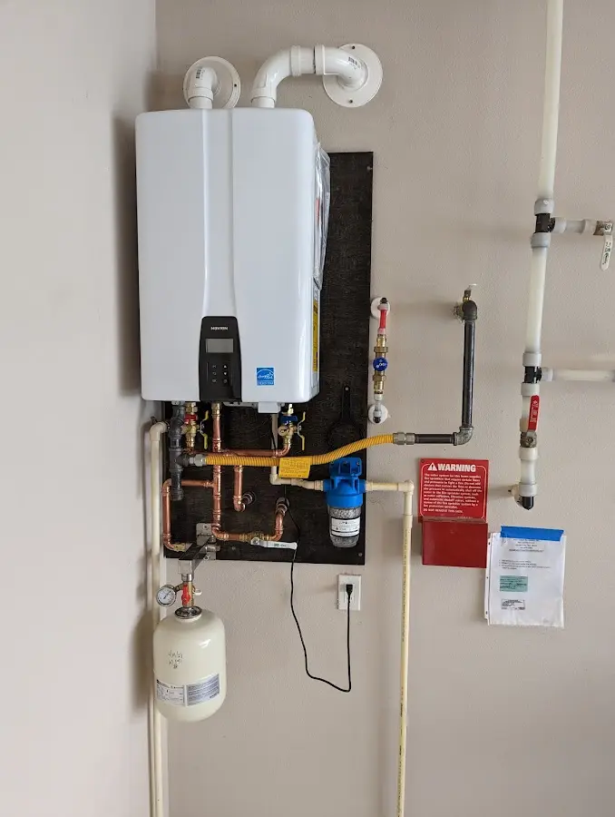 Professional plumber installing copper piping in a Guntersville home